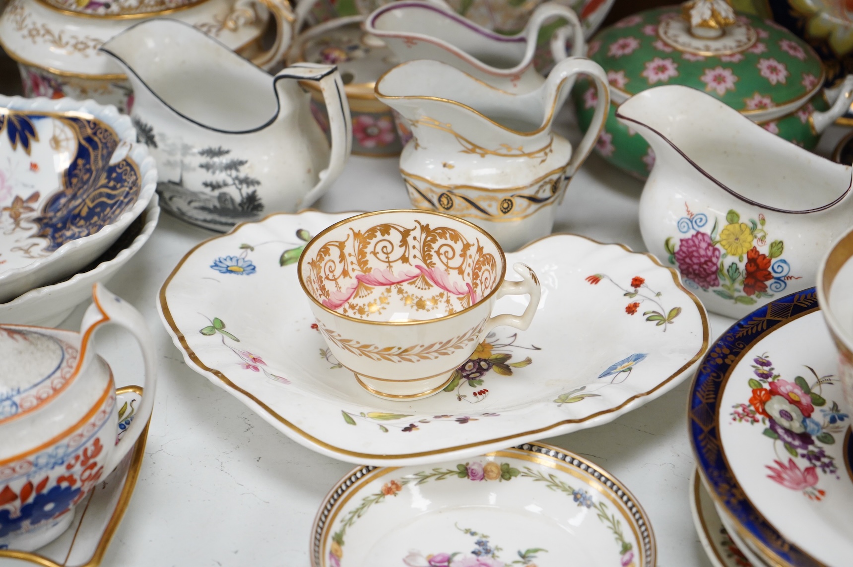 A collection of early 19th century English porcelain tea, dessert and dinner wares including Derby dessert plates, Bloor Derby, Barr Flight & Barr plate, Spode, Coalport etc.